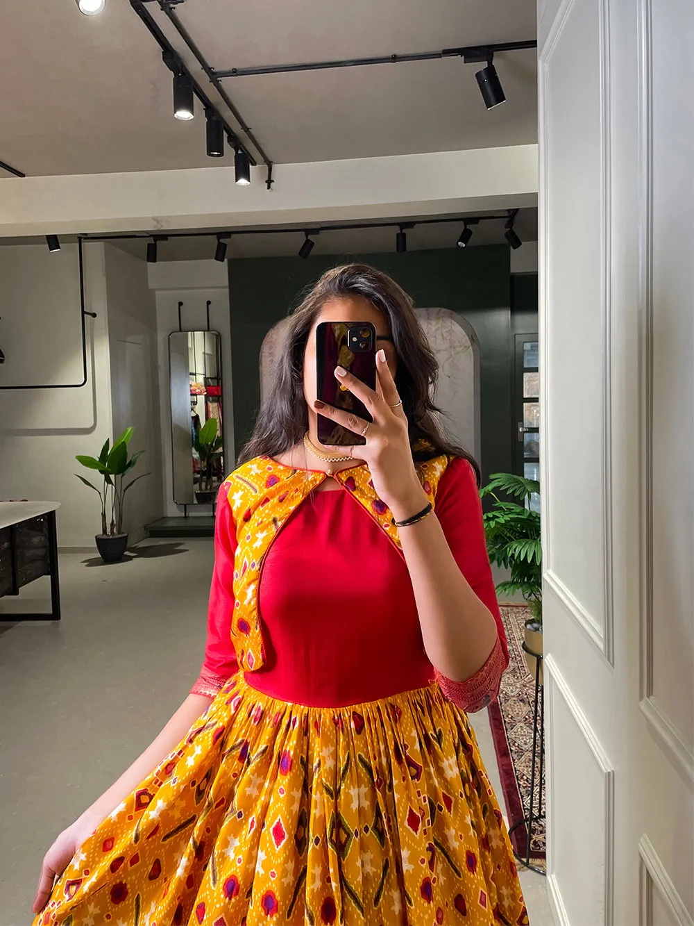 Yellow Color Patola Printed And Foil Printed Dola Silk Gown